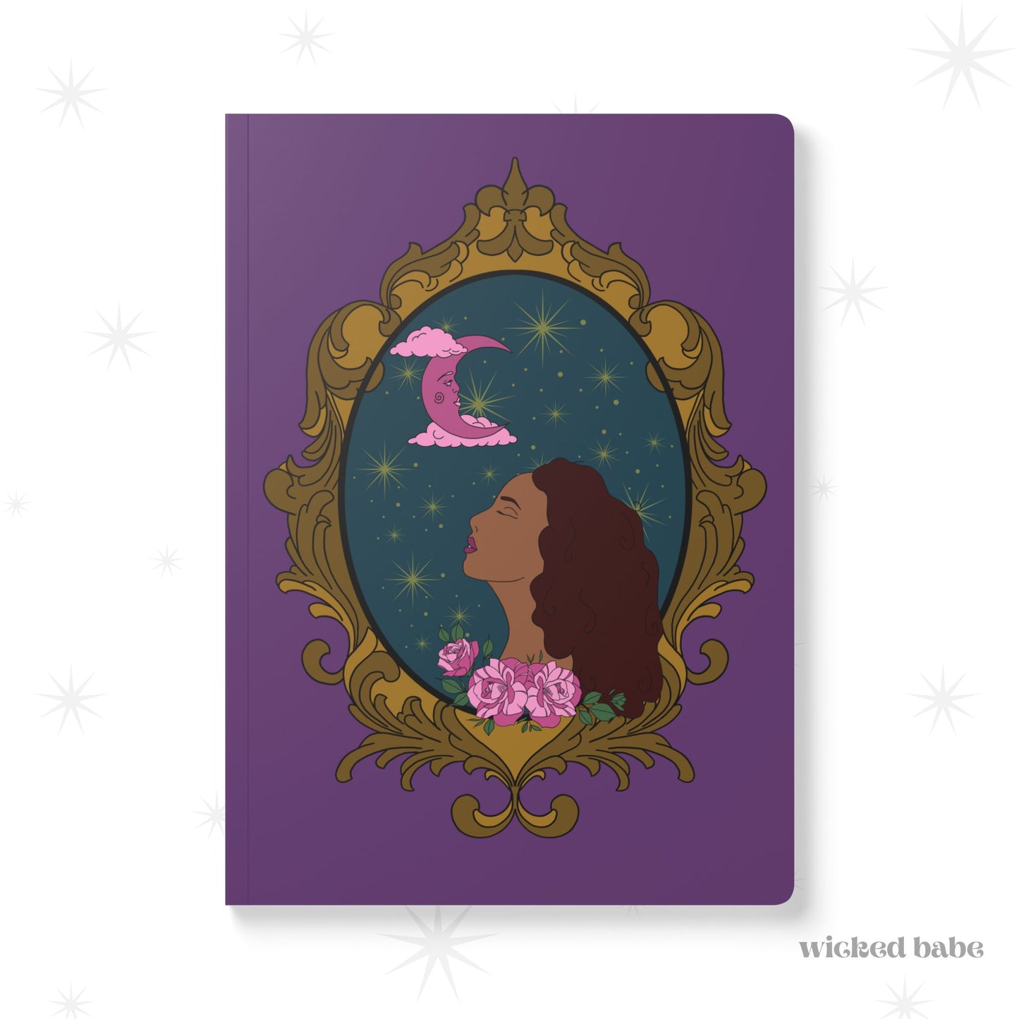 Front cover of purple softcover journal notebook with design of a tan skinned woman with red brown wavy hair with pink flowers and a pink crescent moon above on a teal background surrounded by an ornate gold frame