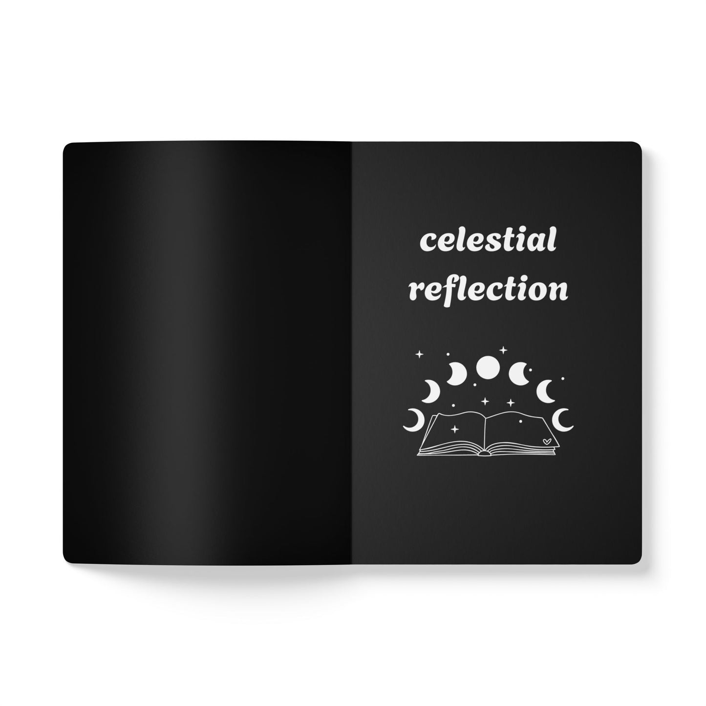 Inside first page of black journal notebook with celestial reflection text in white and a book with moon phases graphic