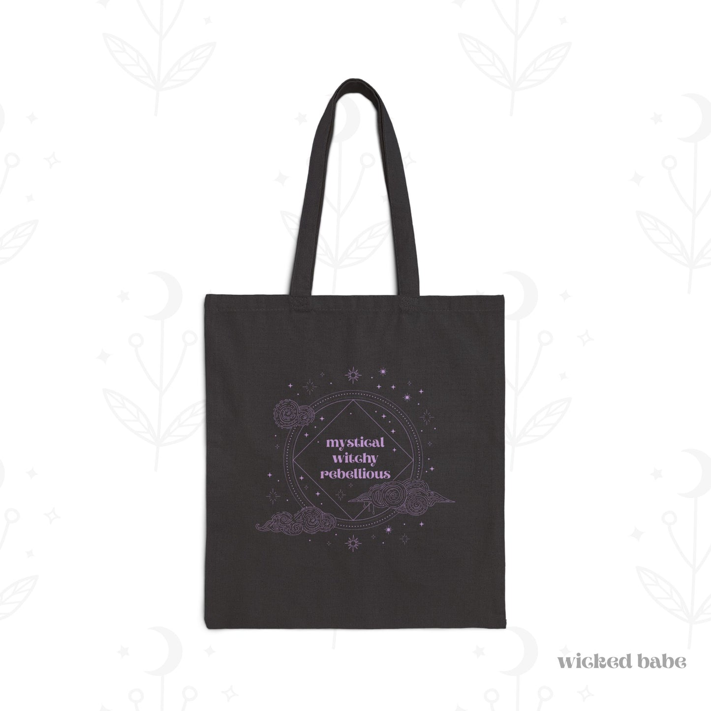 Black tote bag with mystical witchy rebellious text in purple surrounded by clouds and stars