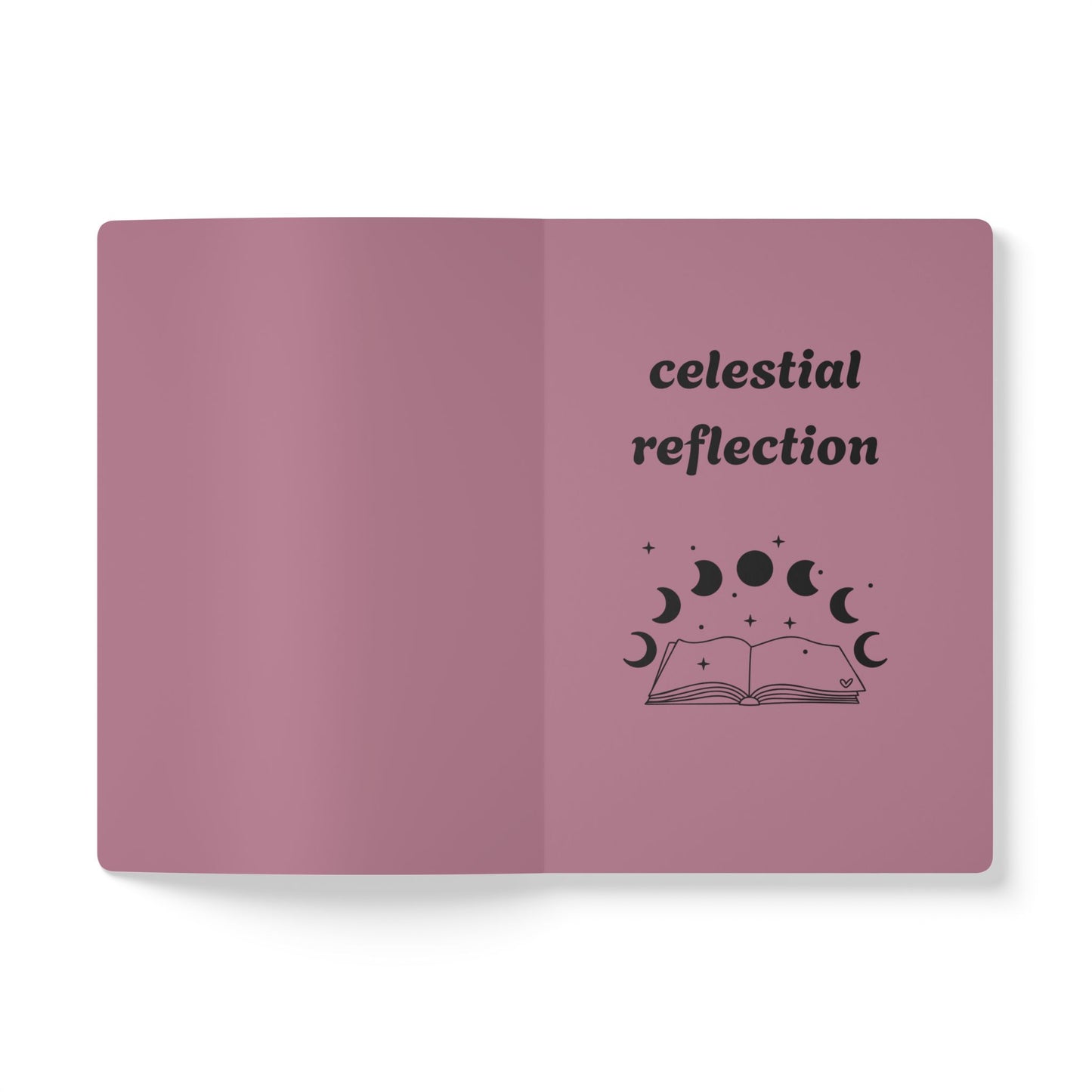 Inside first page of pink journal notebook with celestial reflection text in black and a book with moon phases graphic
