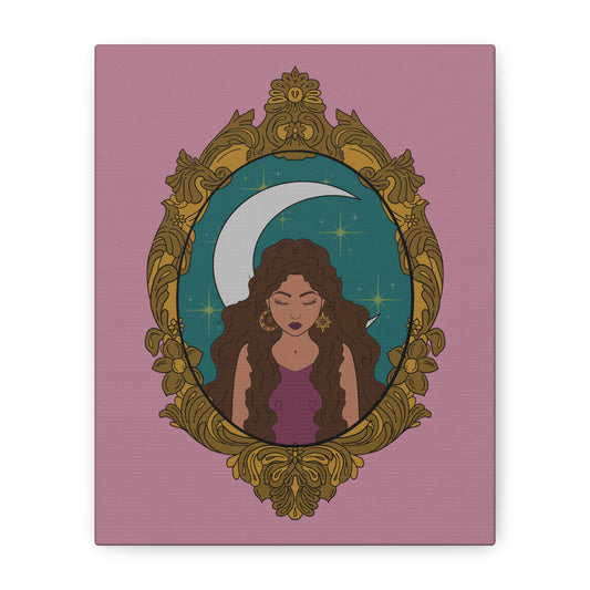 Front view of matte pink canvas wall art with design of a tan skinned woman with brown wavy hair wearing purple in front of large crescent moon on a teal background surrounded by ornate gold frame