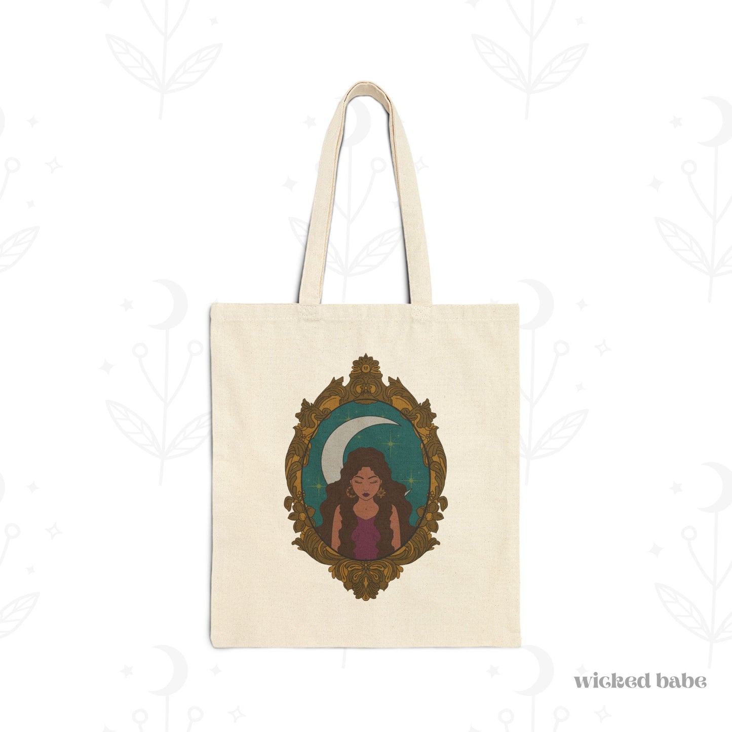 Canvas tote bag with design of a tan skinned woman with brown wavy hair wearing purple in front of large crescent moon on a teal background surrounded by ornate gold frame