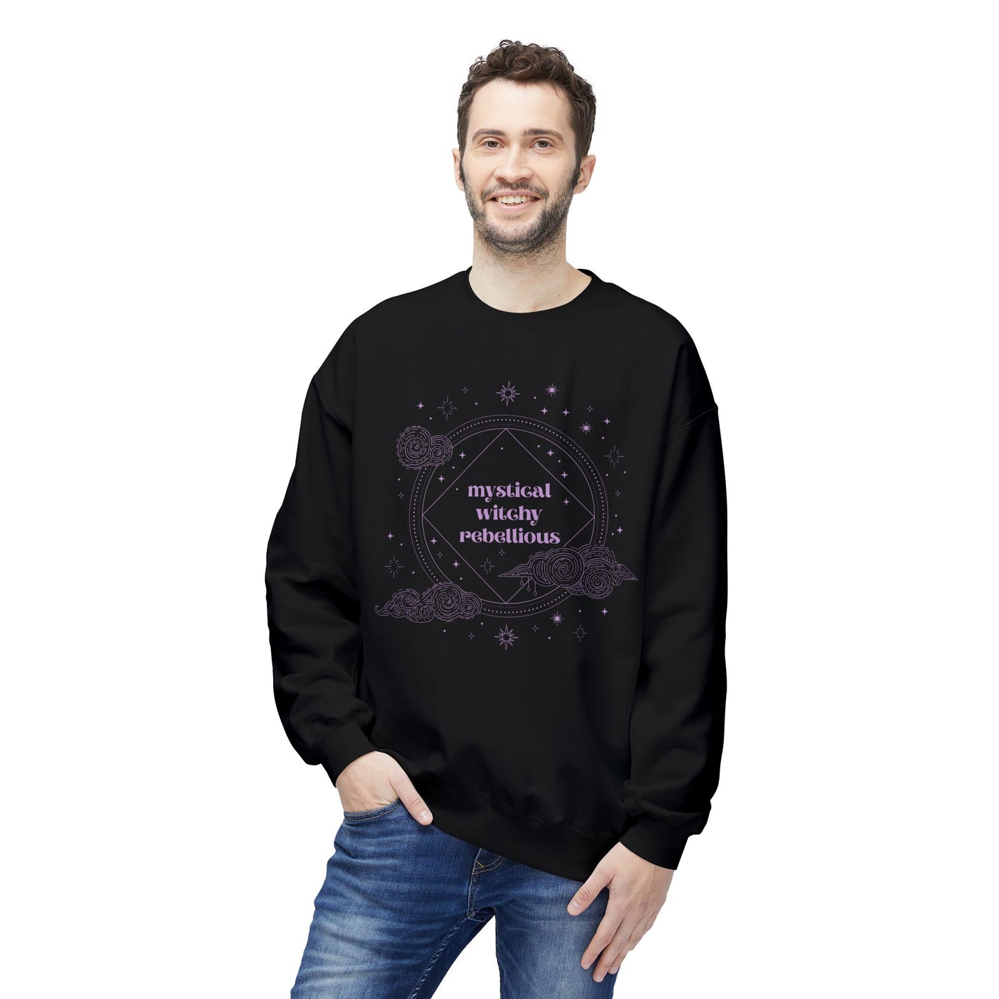 Man wearing a black long sleeve crewneck sweatshirt with mystical witchy rebellious text in purple surrounded by clouds and stars