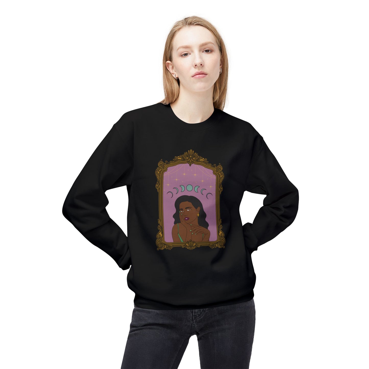Woman wearing a black long sleeve crewneck sweatshirt with design of a dark skinned woman with black hair wearing green on a pink background with moon phases above surrounded by ornate gold frame
