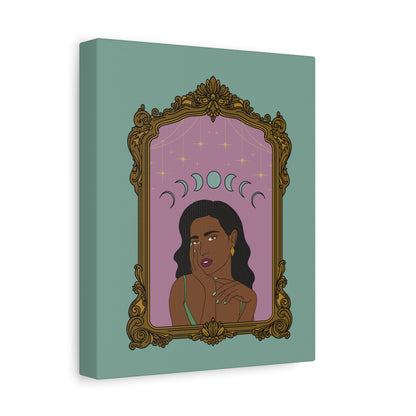 Side view of matte green canvas wall art with design of a dark skinned woman with black hair wearing green on a pink background with moon phases above surrounded by ornate gold frame