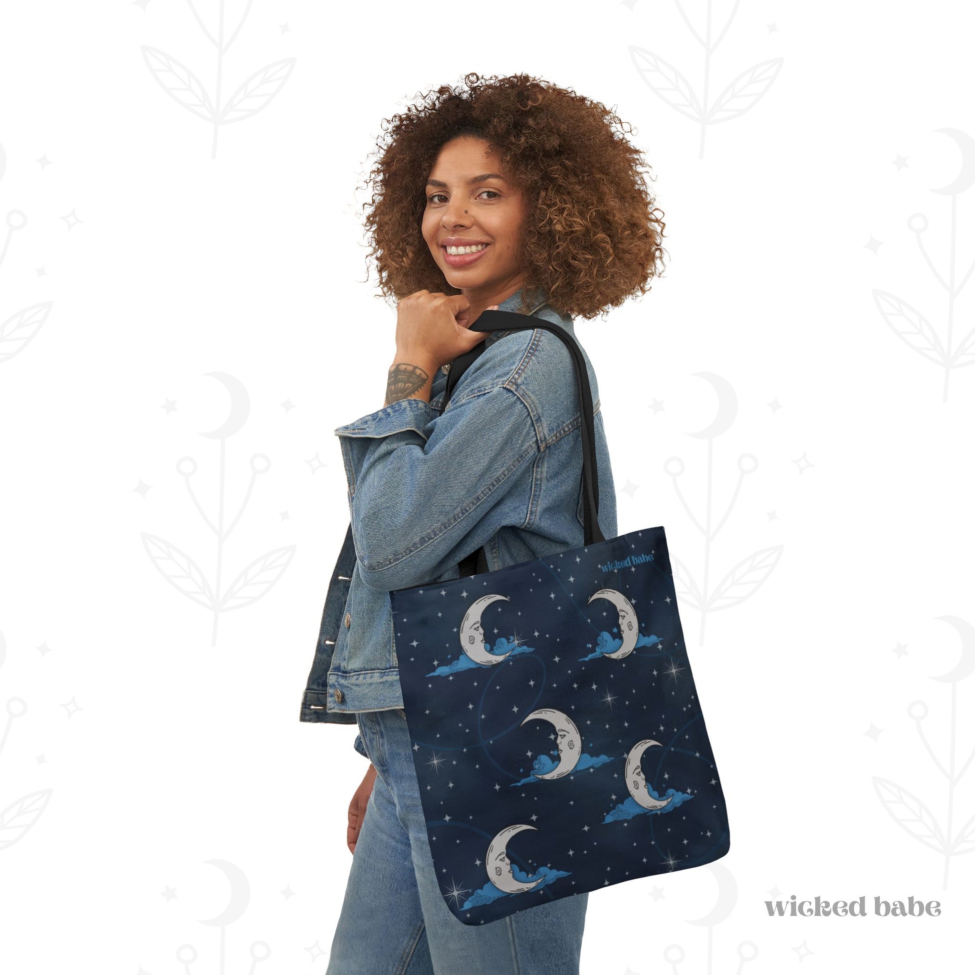 Woman carrying 18x18 inch tote bag with blue celestial sky background with silver crescent moon and stars