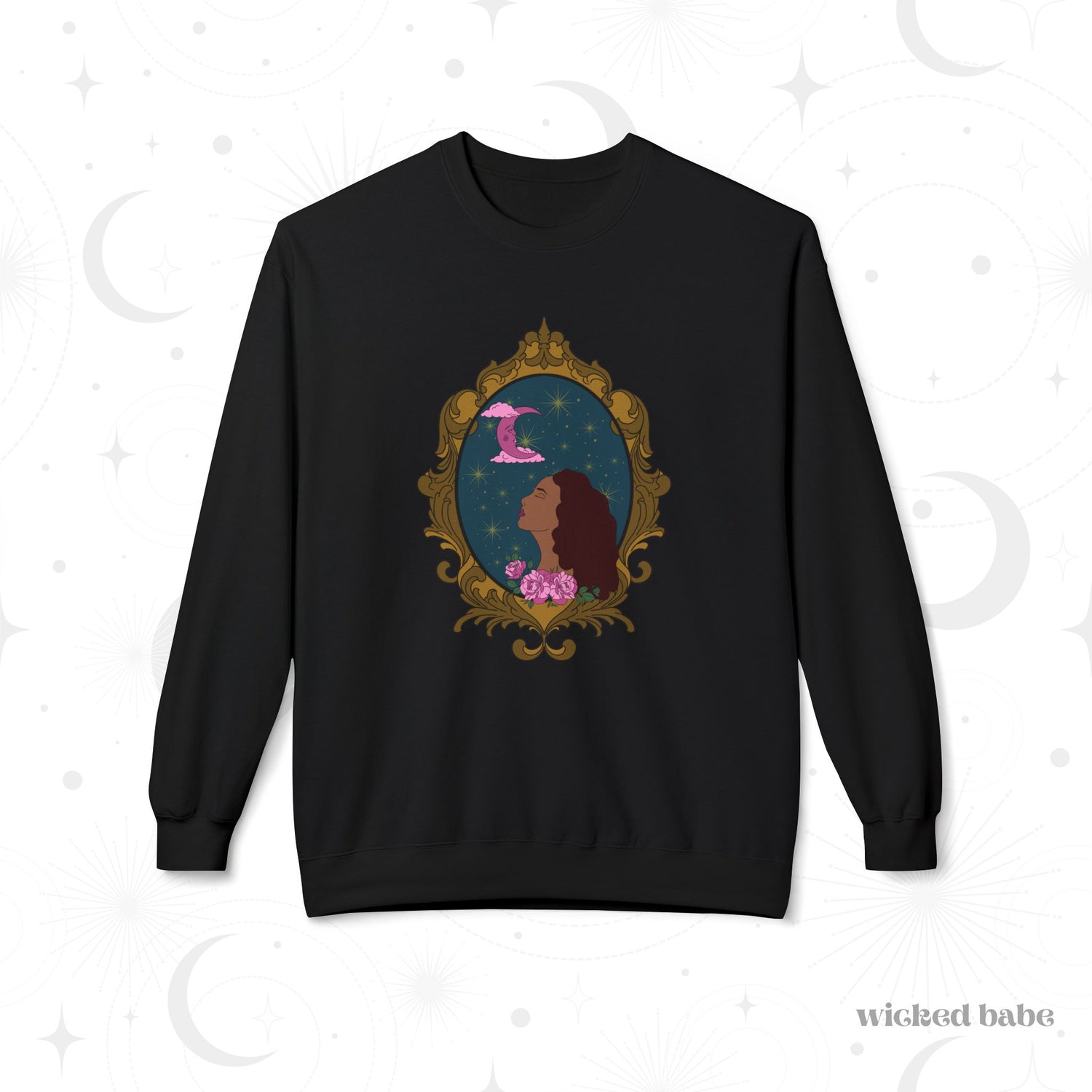 Black long sleeve crewneck sweatshirt with design of a tan skinned woman with red brown wavy hair with pink flowers and a pink crescent moon above on a teal background surrounded by an ornate gold frame