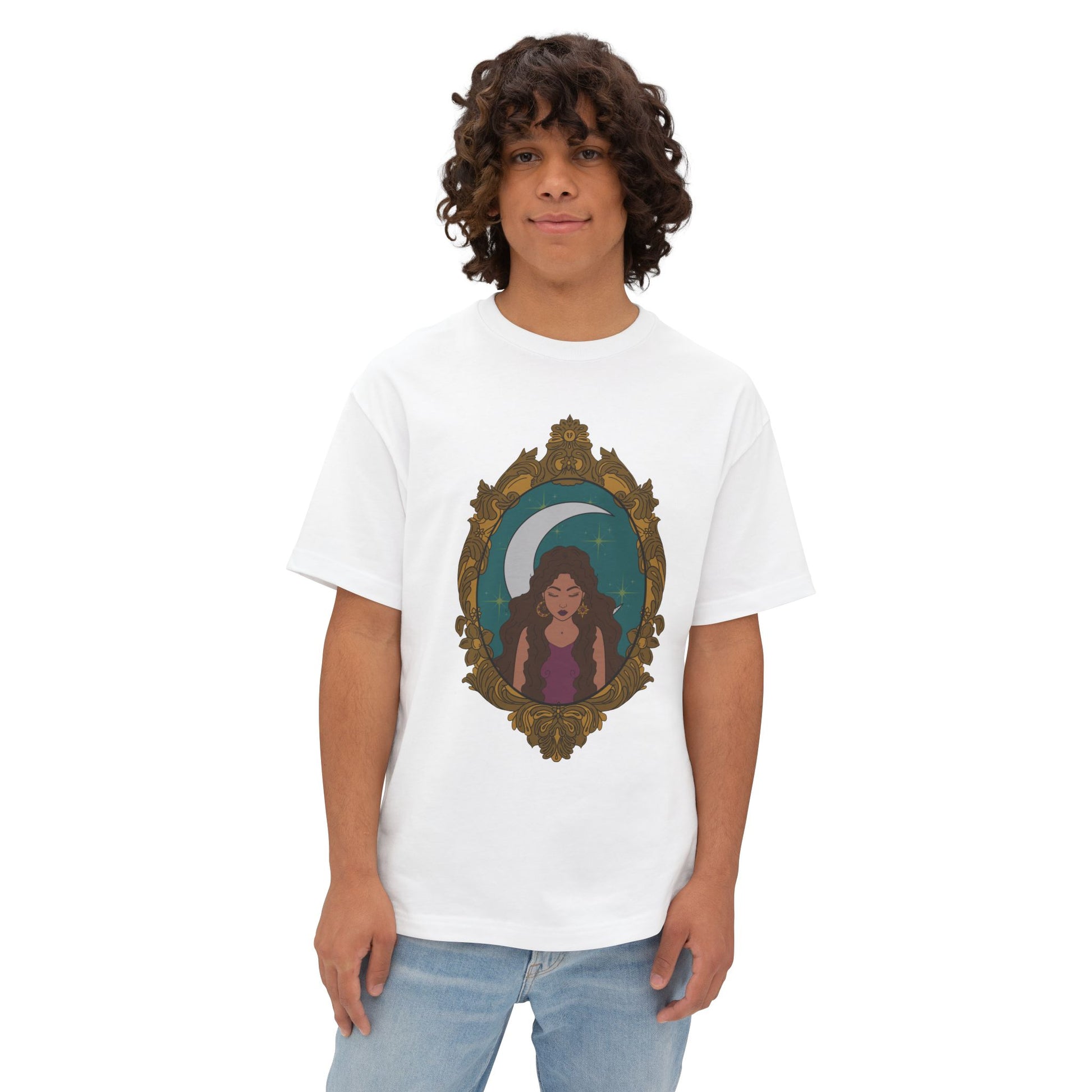 Man wearing an oversized short sleeve white t-shirt with a design of a tan skinned woman with brown wavy hair wearing purple in front of large crescent moon on a teal background surrounded by ornate gold frame