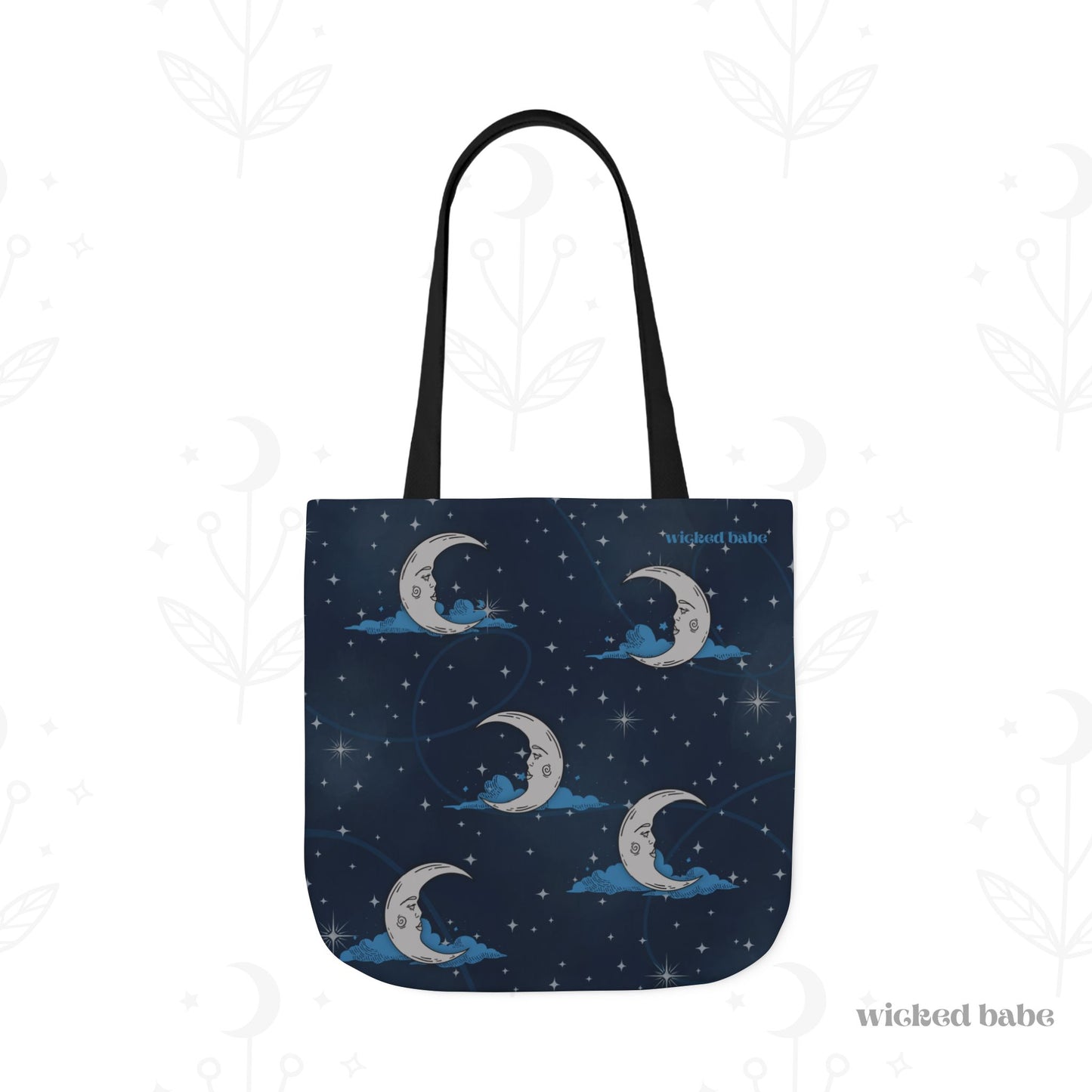 The back of a 18x18 inch tote bag with blue celestial sky background with silver crescent moon and stars