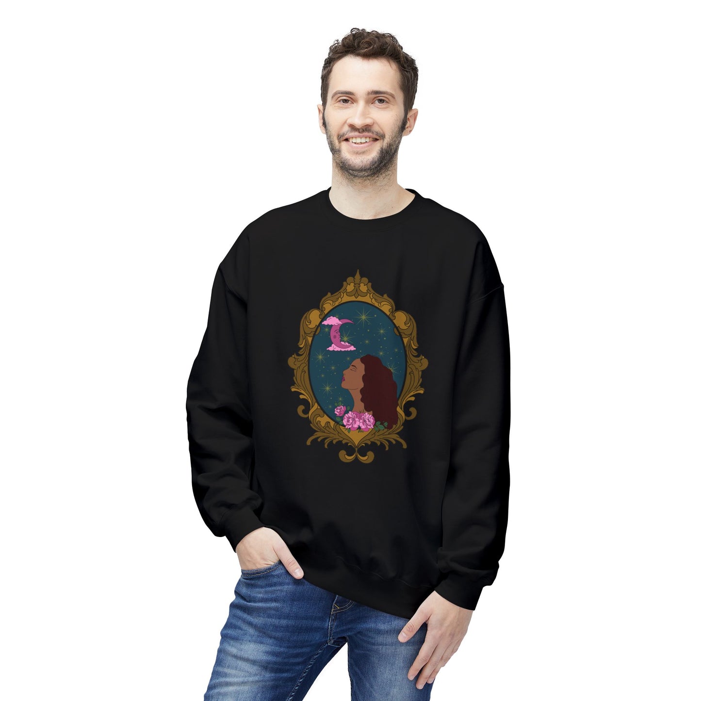Man wearing a black long sleeve crewneck sweatshirt with design of a tan skinned woman with red brown wavy hair with pink flowers and a pink crescent moon above on a teal background surrounded by an ornate gold frame