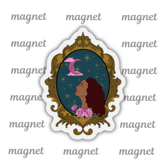 Refrigerator magnet with design of a tan skinned woman with red brown wavy hair with pink flowers and a pink crescent moon above on a teal background surrounded by an ornate gold frame with a white border