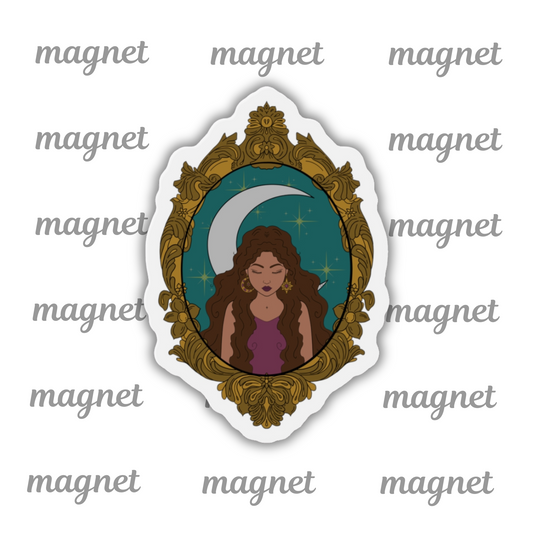 Refrigerator magnet with design of a tan skinned woman with brown wavy hair wearing purple in front of large crescent moon on a teal background surrounded by ornate gold frame with a white border