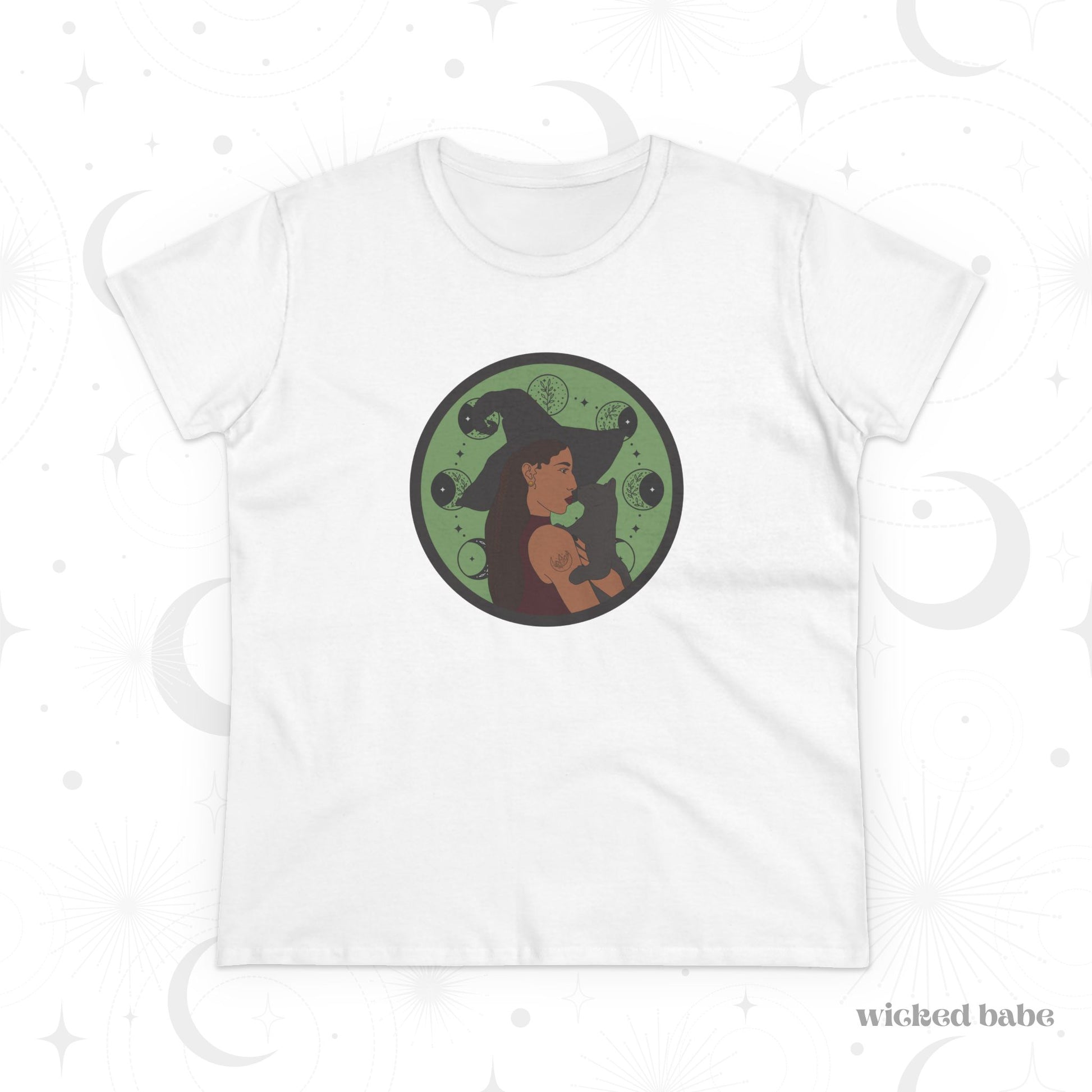 White short sleeve crew neck t-shirt featuring a design of a woman wearing a witch's hat holding a gray cat with moon phases on a green background