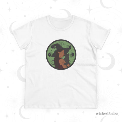 White short sleeve crew neck t-shirt featuring a design of a woman wearing a witch's hat holding a gray cat with moon phases on a green background