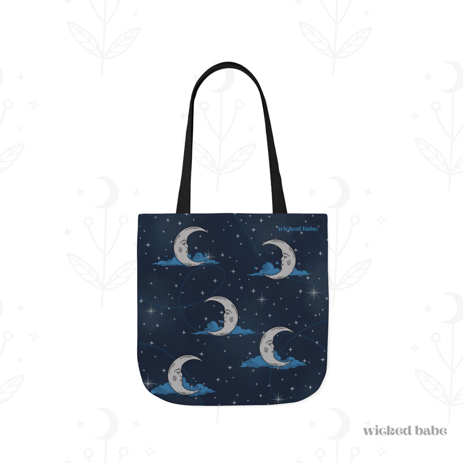 The back of a 16x16 inch tote bag with blue celestial sky background with silver crescent moon and stars