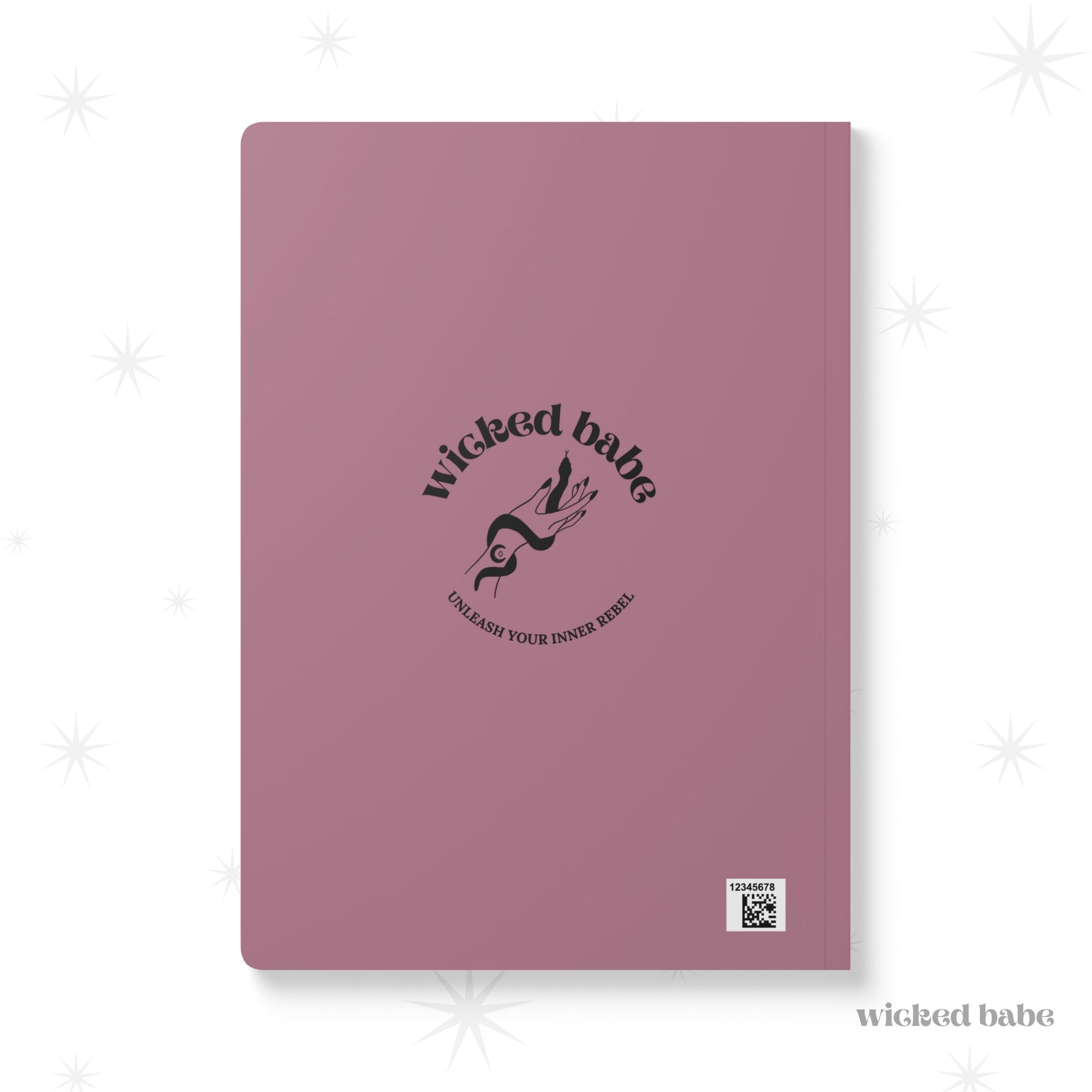 Back of pink softcover journal notebook with black wicked babe hand with serpent logo in the center
