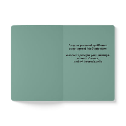Inside second page of green journal notebook with inspirational text in black