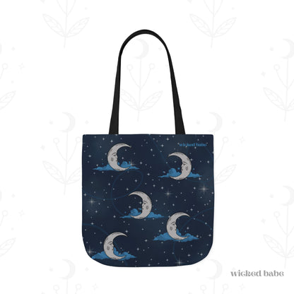 The front of a 18x18 inch tote bag with blue celestial sky background with silver crescent moon and stars