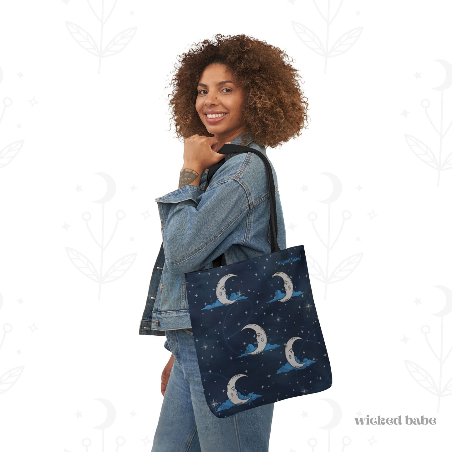Woman carrying 16x16 inch tote bag with blue celestial sky background with silver crescent moon and stars