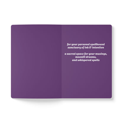 Inside second page of purple journal notebook with inspirational text in white